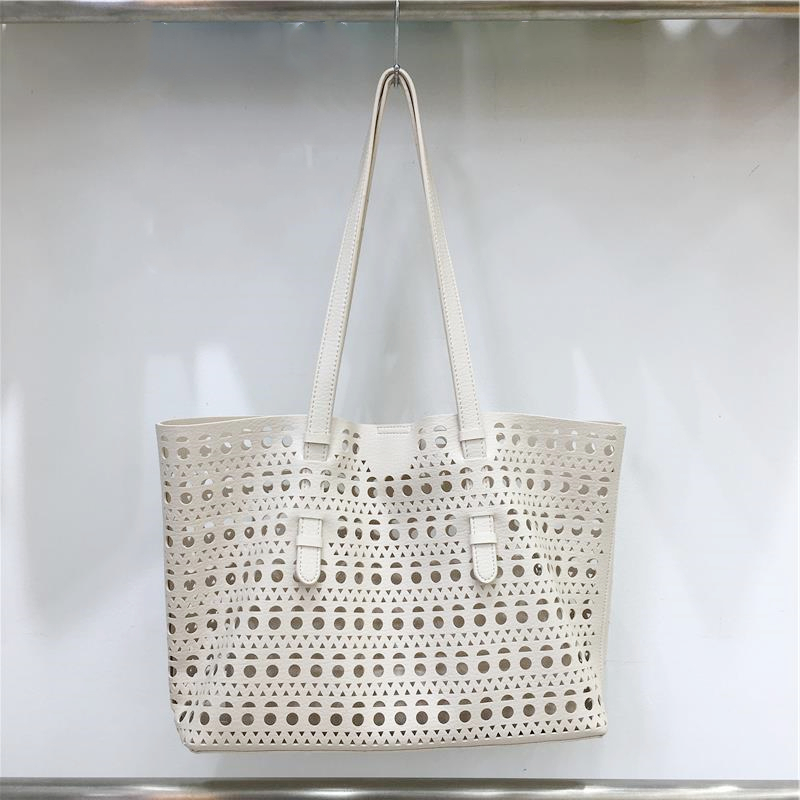 Elegant Hollow Carved Tote Bag - High-End Large Capacity Handbag with Detachable Pouch for Spring/Summer Fashion Elegant Hollow Carved Tote Bag - High-End Large Capacity Handbag with Detachable Pouch for Spring/Summer Fashion