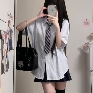 Four-Piece JK Uniform Set for Women: Striped Long Sleeve Shirt, Loose Fit, Pleated Skirt - Trendy 2024 Autumn Style