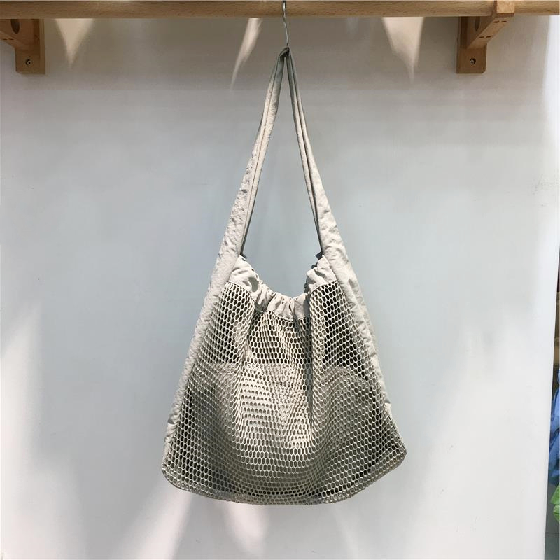 Soft Hollow Nylon Shoulder Tote Bag - Niche Design for Spring/Summer 2025 - Trendy Underarm Style for Everyday Use Soft Hollow Nylon Shoulder Tote Bag - Niche Design for Spring/Summer 2025 - Trendy Underarm Style for Everyday Use